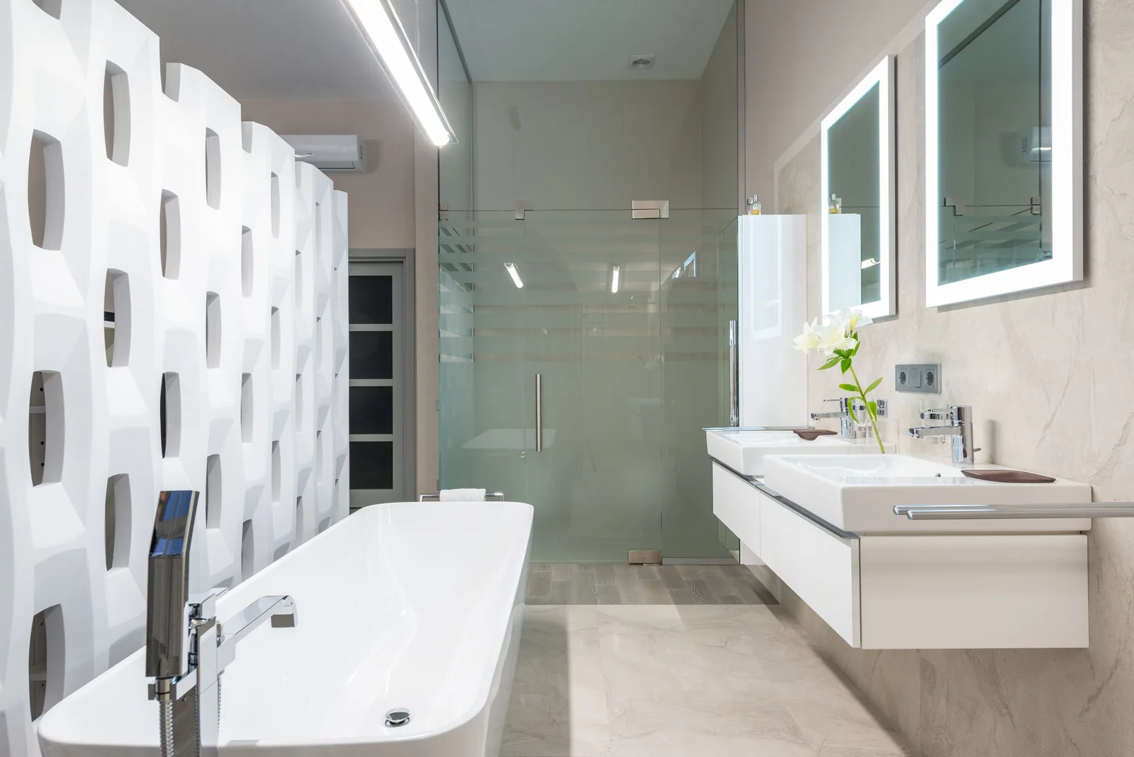 A bright bathroom with a frosted-band glass shower screen