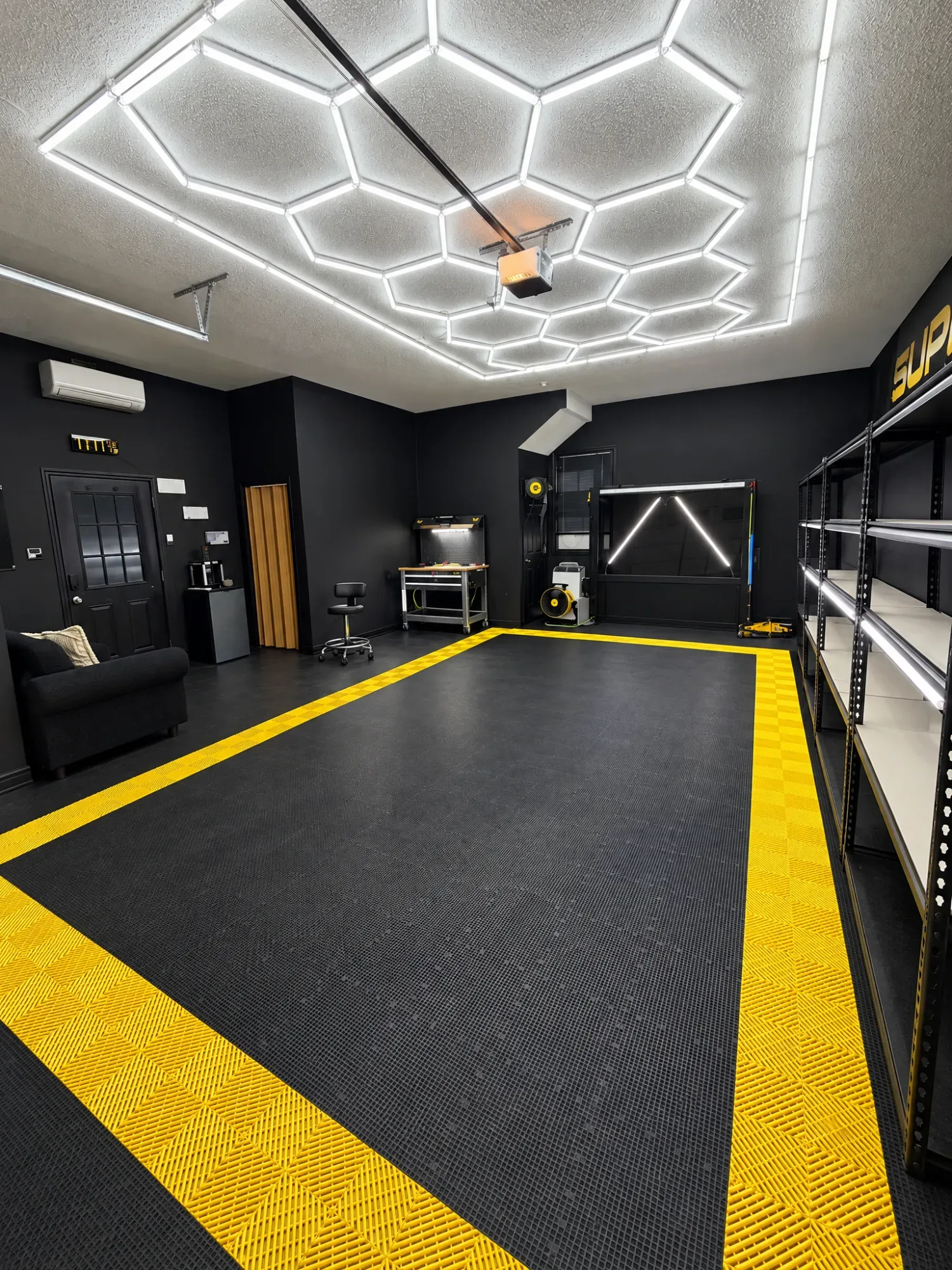 The Supreme Window Tinting studio in Madison under its honeycomb of LED lights